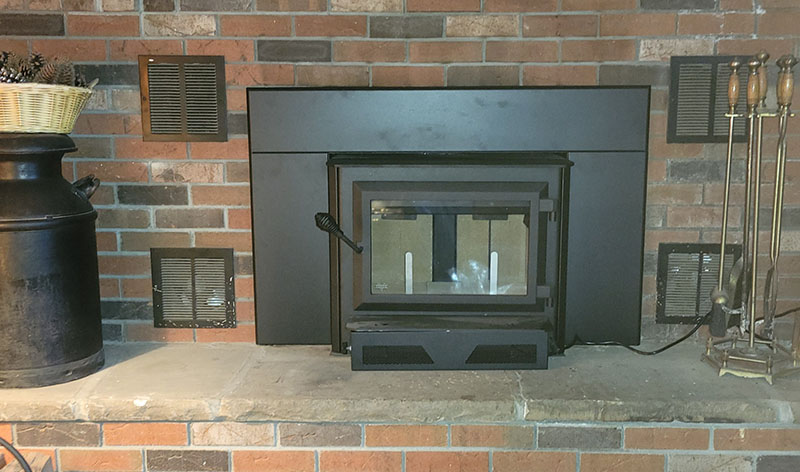 New wood stove with a brick surround